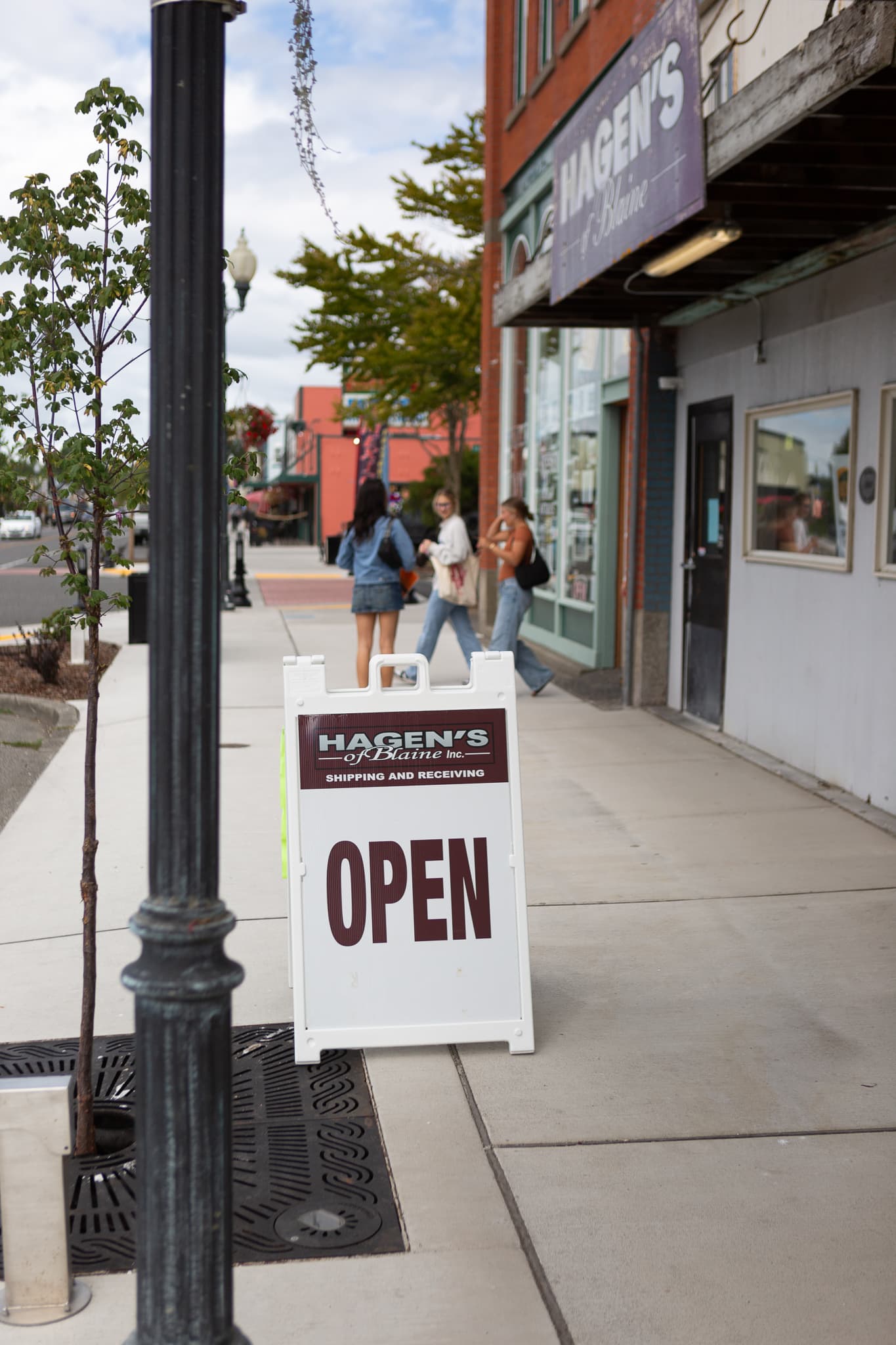 The Hagen's open sign on the street