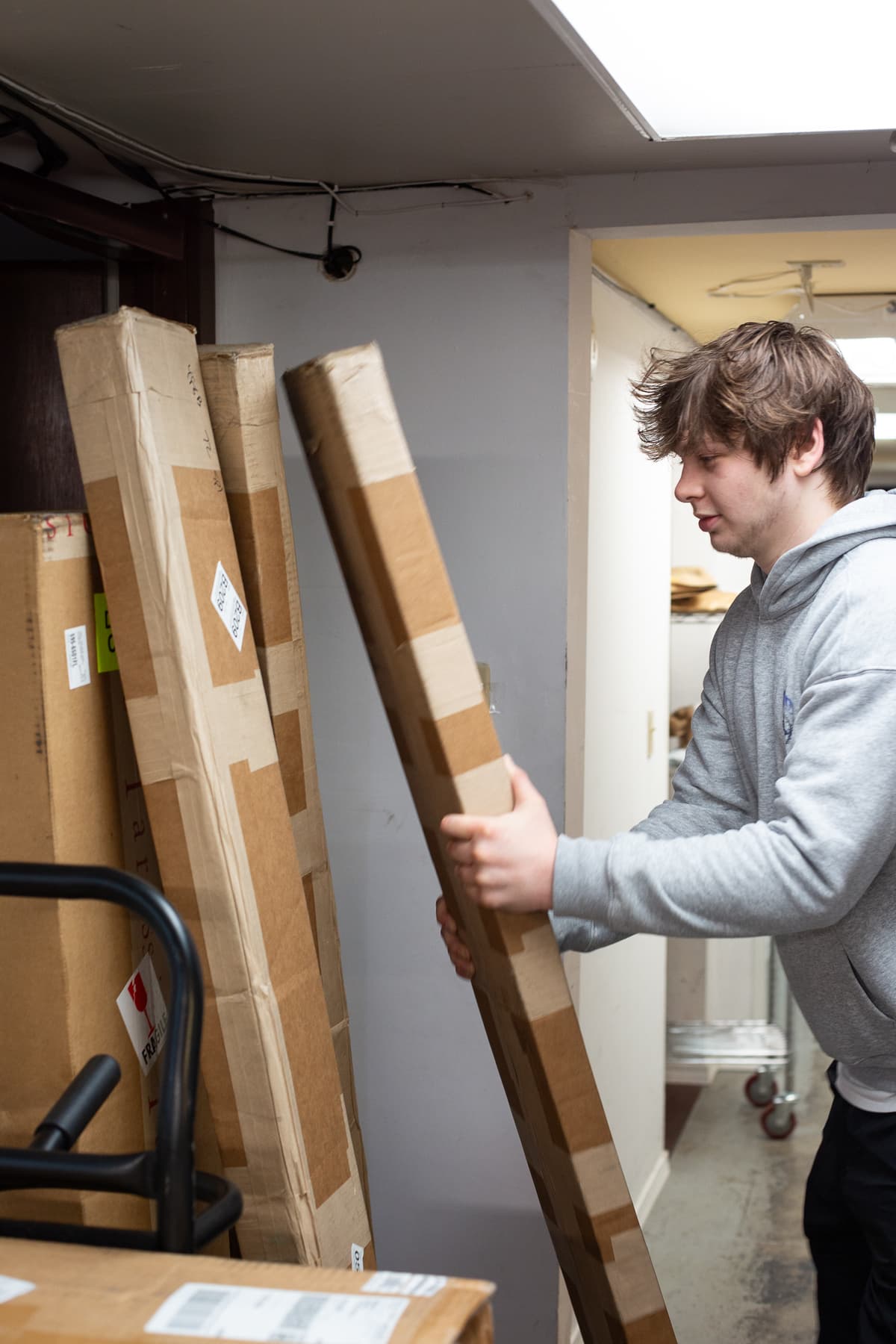 a Hagens employee stacking boxes